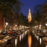 Zuiderkerk from canal at night, Amsterdam, NL