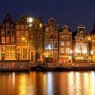 Waterfront houses at night, Amsterdam, NL